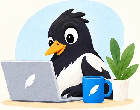 The magpie at its desk with a laptop and a blue mug.